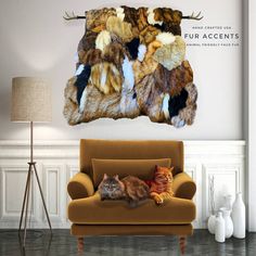 a cat laying on top of a couch next to a wall mounted deer antlers