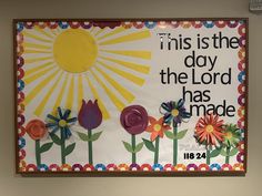 this is the day the lord has made bulletin board with flowers and words on it