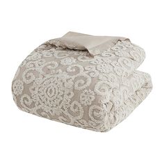 two bedspreads with white lace on them and a light brown pillow case in the middle