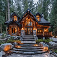 a large log home with stone steps leading up to it