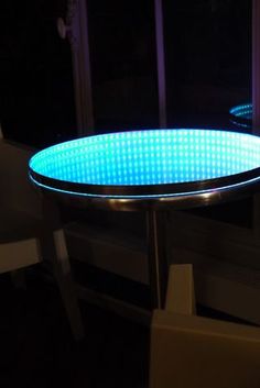 a round table with blue lights on it