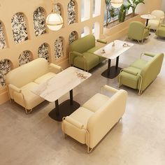 an overhead view of a restaurant with tables, chairs and couches in the center