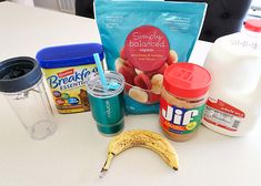 the ingredients to make an oatmeal smoothie are displayed on a table