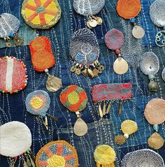 an assortment of beaded and embroidered items on display