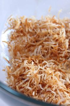 shredded parmesan cheese in a glass bowl