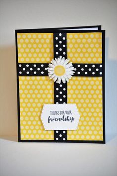 a card that has a daisy on it