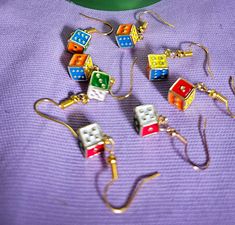 Little metal dice earrings  The dice are small painted metal charms that are on ear wires Perfect for comicon or even a family game night Game Earrings, Dice Earrings, Teacher Earrings, Little Earrings, Metal Charms, Painted Metal, Family Game, Metal Charm, Family Game Night