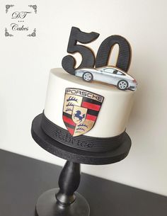 a white and black cake sitting on top of a table