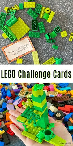 the lego challenge cards are being held up by someone's hand, and there is a pile of legos in front of them