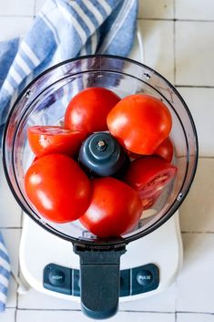 tomatoes in a food processor ready to be blended