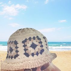 Introducing our groovy Granny Square Bucket Hat, a perfect blend of natural, white, and black colors. Handcrafted with care, this adult-sized hat is made from comfortable cotton, ensuring a hassle-free wearing experience. This versatile hat is not only stylish but also practical. It's easy-to-wear design makes it a convenient choice for any occasion. Whether you're heading to the beach, running errands, or simply enjoying the outdoors, this hat easily folds and fits into any bag, making it your White Crochet Hat One Size For Festival, Handmade White Beach Hats, White Bohemian Hat One Size, Handmade Cream Bohemian Sun Hat, Handmade Bohemian Cream Sun Hat, Bohemian Crochet Hat For Outdoors, Bohemian Crochet Hat In Cream, Bohemian Cream Crochet Hat One Size, Bohemian Cream Handmade Sun Hat