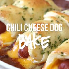 a white bowl filled with cheesy hot dogs covered in cheese and chili sauce