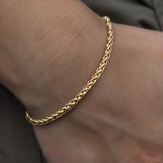 Introducing the Palm Chain Bracelet in Yellow Gold, the bolder 4mm version. This versatile 18k Yellow Gold bracelet features a braided rope design that will instantly level up your look. This piece is ideal for stacking and accessorizing any outfit- day or night. Pair it with the Palm Necklace in 4mm for the perfect matching set! This product is guaranteed for life – GLD will repair or replace the item should you experience any defects in craftsmanship or breakage. Specifications - Width: 4mm - Luxury Yellow Gold Braided Bracelet Gift, Palm Necklace, White Gold Bracelet, Braided Rope, Rope Design, Vermeil Jewelry, Custom Earrings, Yellow Gold Bracelet, Gold Plated Bracelets