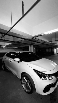 a white car parked in a parking garage