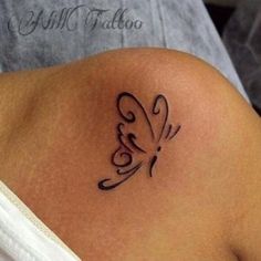 a woman with a tattoo on her stomach has a butterfly in the middle of it