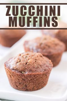 zucchini muffins on a white plate with text overlay that reads zucchini muffins