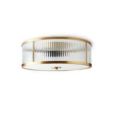 an image of a modern flush light fixture in gold and white colors on a white background