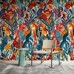 a chair and table in front of a colorful wallpaper