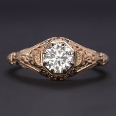 an antique diamond ring with filigree details