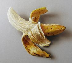 a peeled banana sitting on top of a table