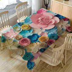 a dining room table covered with paper flowers