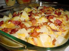 a casserole dish with bacon and cheese in it