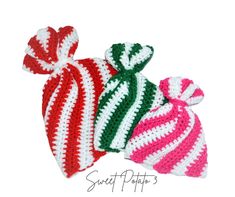 three crocheted hats with bows on them