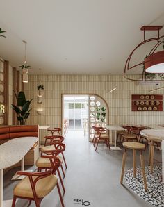 the interior of a restaurant with tables and chairs