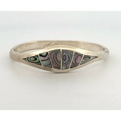 Transport Yourself To The Golden Era Of Mexican Craftsmanship With This Exquisite Vintage Alpaca Mexico Silver Bracelet. Crafted With Precision And Adorned With Mesmerizing Abalone Accents, This Cuff Bangle Bracelet Exudes Timeless Elegance And Cultural Richness. The Hinged Design Ensures A Comfortable Fit For Wrists Up To 6 Inches In Circumference, Making It A Versatile Addition To Any Jewelry Collection. Perfect For Adding A Touch Of Vintage Charm To Any Ensemble, This Estate Piece Captures The Essence Of Mexican Artistry And Craftsmanship. Features: Cuff Bangle Bracelet Size: Womens 6"In Condition: Pre-Owned Excellent Preowned Condition Poshmark Vintage Mexican Jewelry, Mexican Jewelry, Cuff Bangle Bracelet, Cuff Bangles, Bracelet Sizes, Vintage Charms, Bangle Bracelet, Womens Jewelry Bracelets, The Golden