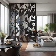 a living room filled with furniture and lots of windows next to a dining table on top of a hard wood floor