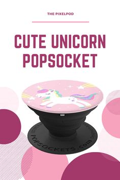 the pink unicorn popsocket is sitting on top of an object with circles around it