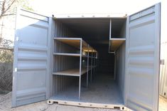 an open storage container with shelves in it