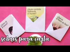 three envelopes sitting next to each other on top of a pink surface with the words sombres para carta written in spanish