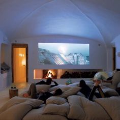 two people laying on bean bags in a living room