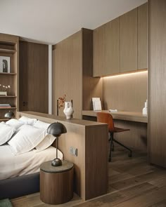 a bed sitting in a bedroom next to a wooden desk and book shelf on top of a hard wood floor