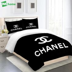 black and white bedding with chanel logo on it