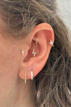 Discover the UK's finest selection of dainty solid gold cartilage huggies, hoops & studs for helix, high lobe, rook, tragus, daith and conch at Laura Bond. We ship worldwide! Ear Constellation, Gold Lightning, Ear Party, Earring Post, Silver Bars, Cz Diamond