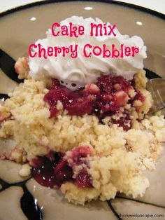 a close up of food on a plate with text overlay that reads cake mix cherry cobbler who needs a cape?