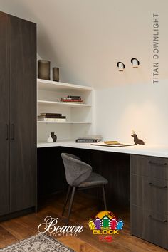 an office with a desk, chair and bookshelf