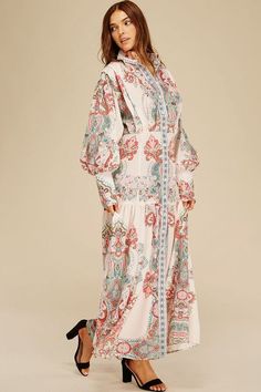 Printed maxi dress with a shirt-style top and pleated skirt Button-down front for adjustable styling Not see-through but not lined for a lightweight feel True to size fit Material: 95% Polyester, 5% Cotton Chic Floral Print Maxi Dress For Daywear, Spring Beach Button-up Maxi Dress, Billowy Long Sleeve Floral Maxi Dress, Floral Print Floor-length Maxi Dress For Daywear, Flowy Midi Maxi Dress With Floral Print, Feminine Long Skirt Maxi Dress For Summer, Flowy Spring Maxi Dress With Button Closure, Modest Billowy Maxi Dress, Vacation Maxi Dress With Button Closure And Long Sleeves