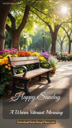 a bench sitting in the middle of a park with flowers on it and words happy sunday