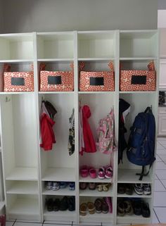 a white closet filled with lots of shoes and bags on top of it's shelves