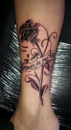 a woman's foot with a rose on it and the words forever in my heart