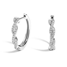 Twisted Vine Diamond Hoop Earrings - 18K White Gold. These stylish and eye-catching earrings feature dazzling round diamonds prong-set in twisting vines of lustrous, precious metal (1/6 total carat weight). Elegant White Gold Hoop Earrings, Ring Style Guide, Trending Engagement Rings, Heart Engagement Rings, Jewelry Diamonds, Ring Trends, Brilliant Earth, Ear Rings, Engagement Rings For Men