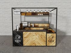 an outdoor food stand with wooden counter tops and shelves on the side, along with white brick walls