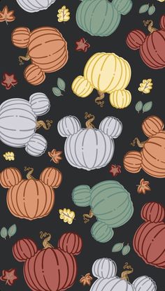 mickey mouse pumpkins and acorns on a black background