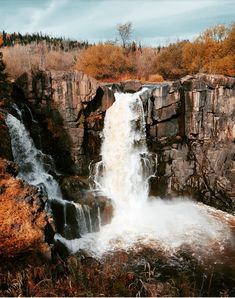 there is a waterfall that has water coming out of it