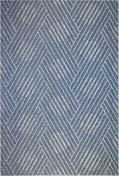 a blue and white rug with diagonal stripes