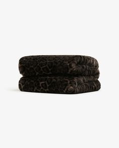 leopard print towels stacked on top of each other