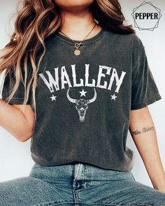 "Vintage Wallen Western Comfort Colors Shirt, Trendy Cowgirl Country Shirt, Wallen Western T Shirt, Retro Cowboy Wallen Shirt,Cowboy Cowgirl  ------------- Welcome to our little shop! You will love this trendy garment-dyed t-shirt that is made 100% with ring-spun cotton. The comfort colors soft-washed, garment-dyed fabric brings extra coziness to your wardrobe while the relaxed fit makes it an excellent daily choice. This is a standard unisex size Comfort Colors Tee. For an oversized tee, please size up. If you are looking for an oversized \"T-shirt Dress\" look, we recommend sizing up 2 sizes. Please review the size chart to ensure you receive the fit you want. HOW TO ORDER Select the t-shirt size, color and quantity from the drop-down menu. If you want a custom product send us a message! Wallen Shirt, Howdy Shirt, Country Music Shirts, Cowboy Shirt, Skull Shirt